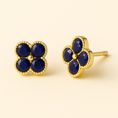 14K Yellow Gold Sapphire Clover Stud Earrings featuring four-petal clover design with round blue sapphires totaling 0.36 carats, polished gold finish, elegant fine jewelry for women by Vaskia Jewelry