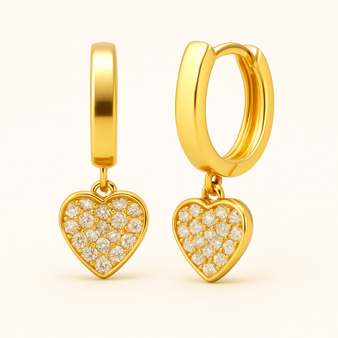 14K Yellow Gold Cubic Zirconia Heart Charm Huggie Earrings featuring 46 pavé-set white stones, 10mm hoops, hinged clasp, by Vaskia Jewelry.
