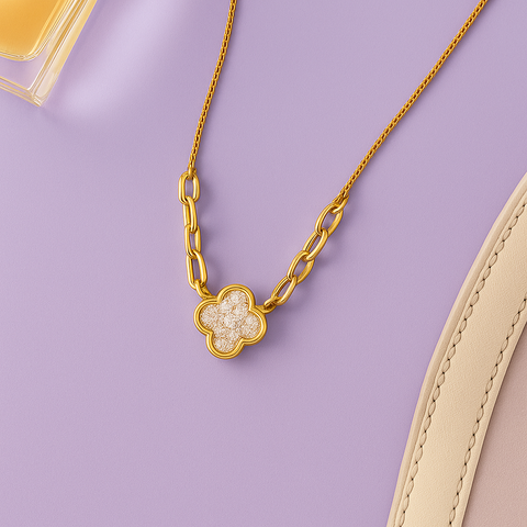 Flat lay product shot of 14K Yellow Gold Diamond Clover Necklace – 0.16 Carats on lilac background