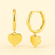 14K Yellow Gold Heart Charm Huggie Earrings featuring petite polished gold hearts, 10mm huggies, safe for sensitive ears, by Vaskia Jewelry