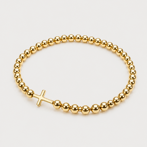 14K yellow gold bead stretch bracelet with smooth horizontal cross centerpiece, high polish, angled side view