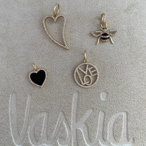 14K Yellow Gold diamond love circle pendant with round white diamonds, side view