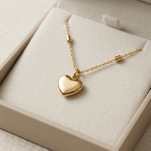 14K Yellow Gold mini heart necklace, angle view