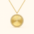 Product shot of 14Kt Yellow Gold fluted disc pendant necklace with pavé diamond halo on adjustable gold chain.