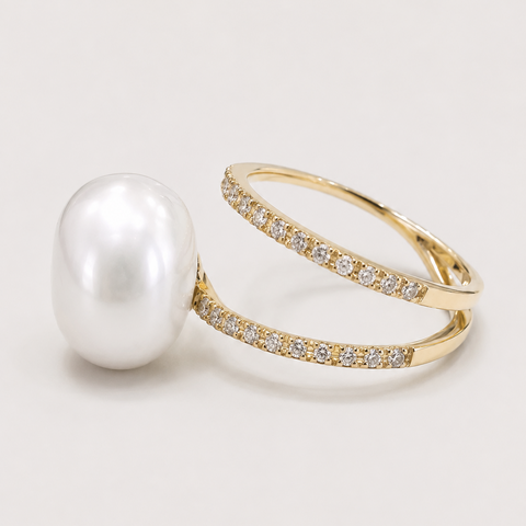 14K yellow gold pavé diamond double band ring with baroque white pearl side view showing double eternity band detail light background
