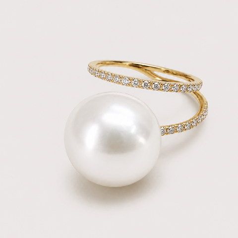 14K yellow gold pavé diamond double band ring with large white pearl center stone angled product shot light gray background