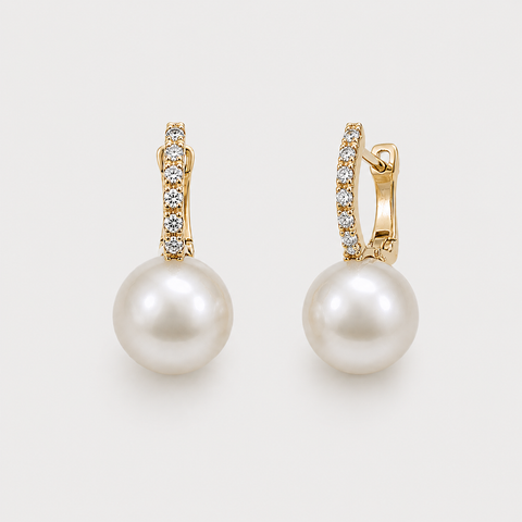 14K yellow gold pavé diamond huggie earrings with white pearl drops front view white background
