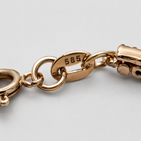 14K rose gold double-row diamond bangle bracelet clasp detail showing 585 hallmark stamp, spring ring clasp and adjustable chain, close-up view