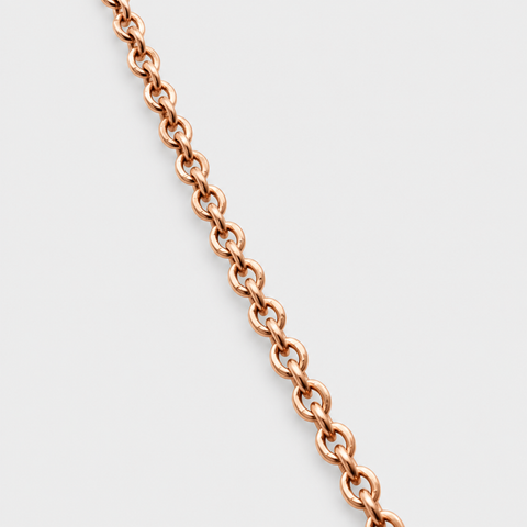 Close-up of the round cable links on the solid 18K Italian rose gold chain necklace