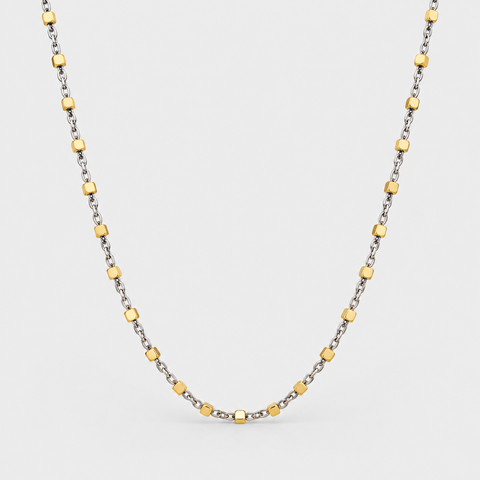 18K two-tone necklace featuring polished yellow gold cube stations evenly spaced along a delicate white gold chain