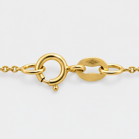Spring ring clasp and 18K hallmark on the 17 inch two-tone gold station necklace by Vaskia Jewelry.
