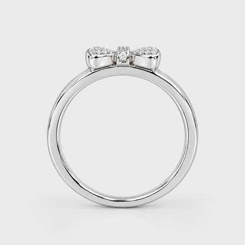 Side profile of an 18K white gold pavé diamond bow ring showing the raised bow setting.