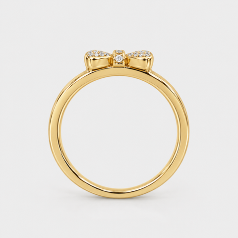 Side profile of an 18K yellow gold pavé diamond bow ring showing the raised bow setting.