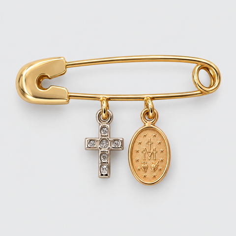 Front view of a solid 18K yellow gold safety pin with a rose gold Miraculous Medal charm and a white gold diamond cross charm, featuring polished finishes and two-tone religious details.