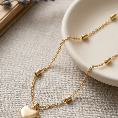 14K Yellow Gold mini heart necklace, detail view