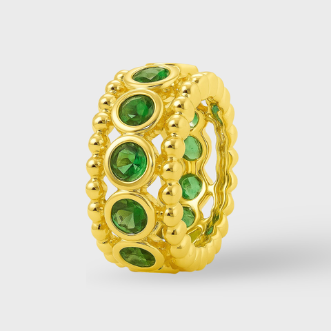 Bezel tsavorite rondelle in 14K gold featuring 11 round green tsavorites framed by polished gold beading.