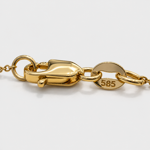 Close-up of 14K yellow gold lobster clasp and 585 hallmark