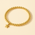 14K Gold Dangling Star Elastic Bead Bracelet