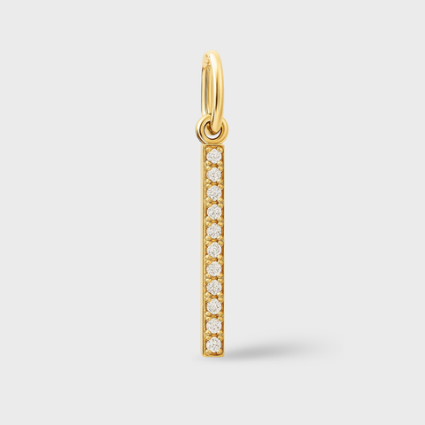 14K yellow gold pavé diamond bar charm with 8 round white diamonds and polished bail.