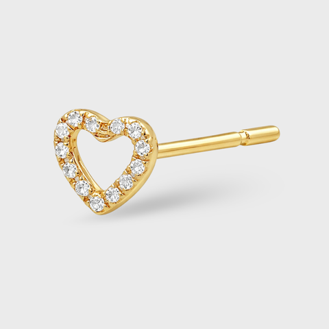 Gold heart-shaped earring with diamonds on a light gray background