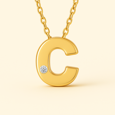 Close-up of 14K gold initial C pendant necklace with diamond accent and polished finish.