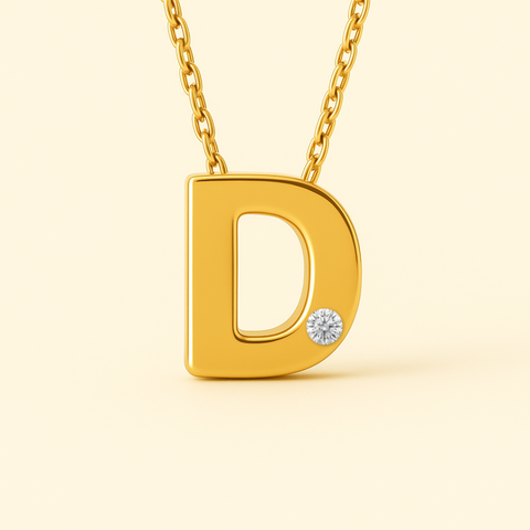 Close-up of 14K gold initial D pendant necklace with diamond accent and polished finish.