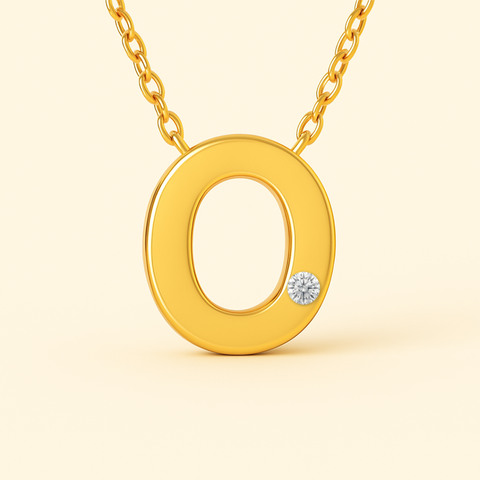 Close-up of 14K gold initial O pendant necklace with diamond accent and polished finish.