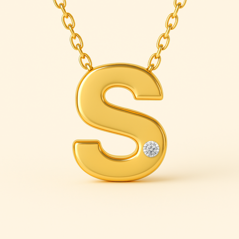 Close-up of 14K gold initial S pendant necklace with diamond accent and polished finish.