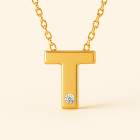 Close-up of 14K gold initial T pendant necklace with diamond accent and polished finish.
