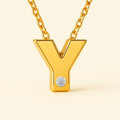 Close-up of 14K gold initial Y pendant necklace with diamond accent and polished finish.
