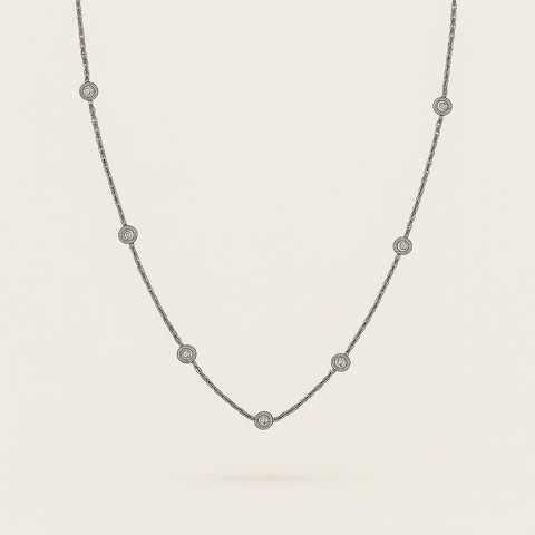 14K white gold diamonds by the yard necklace with six bezel-set round white diamonds on adjustable chain.