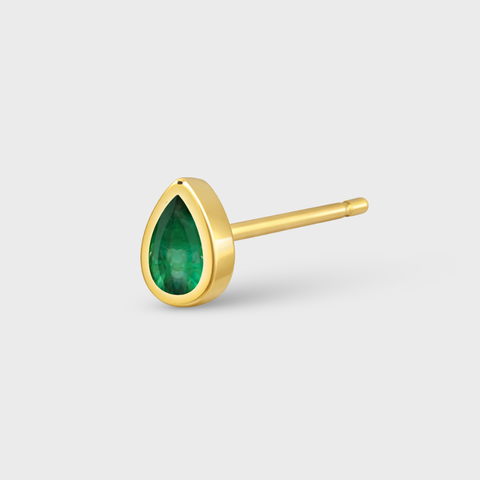 14K Yellow Gold emerald bezeled drop piercing with emerald, front view