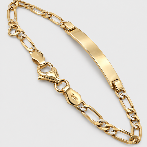 Angled view of the 14K yellow gold Figaro ID bracelet highlighting the curved engravable ID plate, Figaro chain links, and lobster clasp.