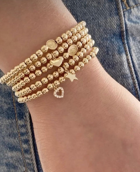 14Kt Zirconia Heart Silhouette Elastic Bead Bracelet