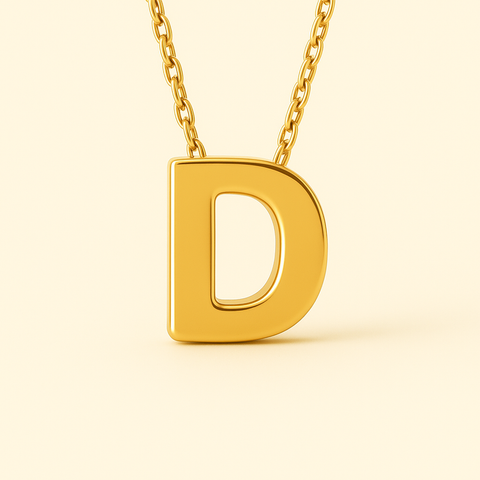 Close-up of 14K gold initial D pendant necklace with polished finish on adjustable chain.