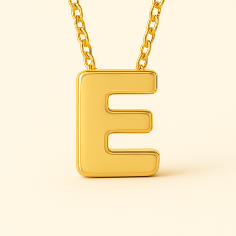 Close-up of 14K gold initial E pendant necklace with polished finish on adjustable chain.