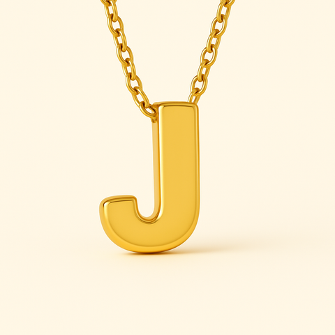 Close-up of 14K gold initial J pendant necklace with polished finish on adjustable chain.