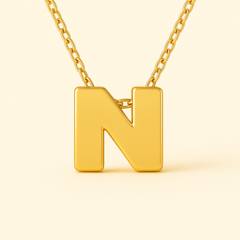 Close-up of 14K gold initial pendant necklace with polished finish on adjustable chain.