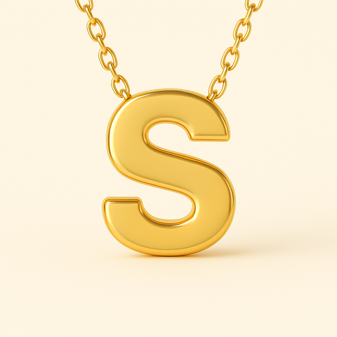 Close-up of 14K gold initial pendant necklace with polished finish on adjustable chain.