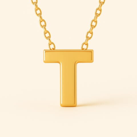 Close-up of 14K gold initial T pendant necklace with polished finish on adjustable chain.