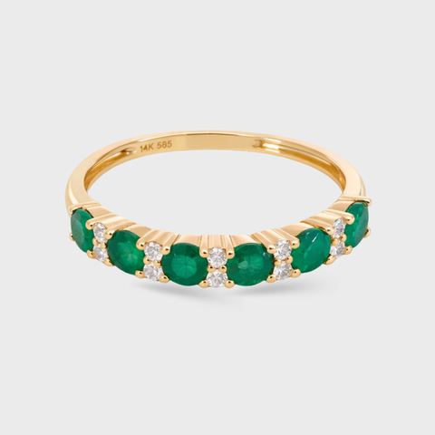14K yellow gold band ring with 7 round emeralds and 12 white diamonds, side view
