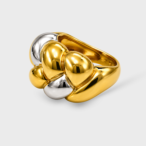 Two-tone 18K Linked Dome ring 45-degree angle showing dimensional braided gold pattern and polished white gold accent