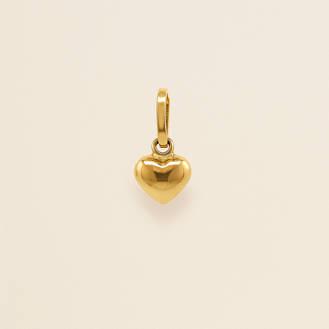 18K yellow gold mini heart pendant with polished finish and Italian craftsmanship.