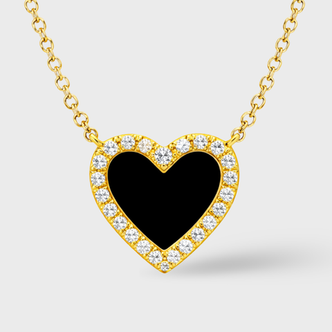 14K yellow gold heart pendant necklace featuring a black enamel center framed by a halo of round brilliant diamonds, suspended from a fine gold chain on a clean white background.