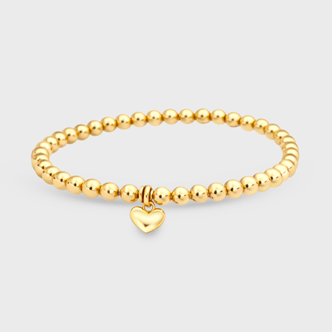 14K yellow gold heart charm elastic bead bracelet with smooth round gold beads and small puffy heart charm, dainty stackable design, front view