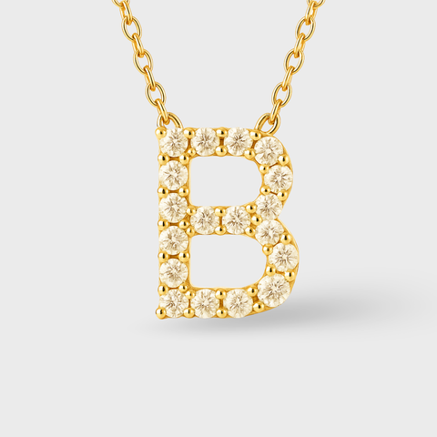 14K Yellow Gold pavé diamond initial necklace with round white diamonds, side view