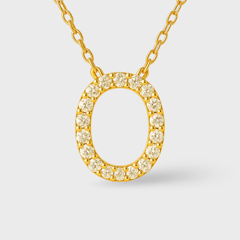 14K Yellow Gold pavé diamond initial necklace with round white diamonds, angle view