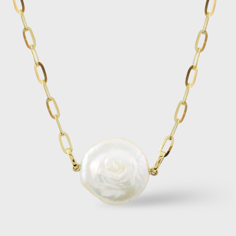 14K yellow gold link chain necklace featuring a large round baroque pearl pendant with natural iridescence, centered on a minimal light background, elegant fine jewelry design.