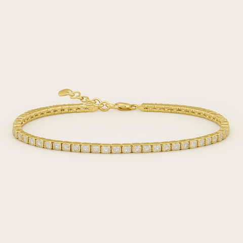 14K yellow gold tennis bracelet with 60 round white diamonds totaling 1.86 carats.