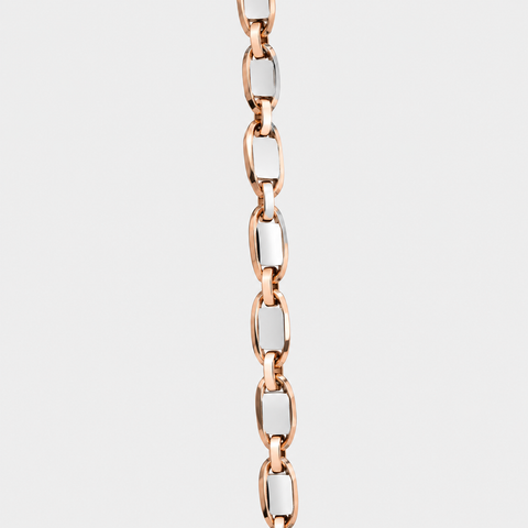 Close-up of the polished rose and white gold Valentino chain links crafted in solid 18K Italian gold.